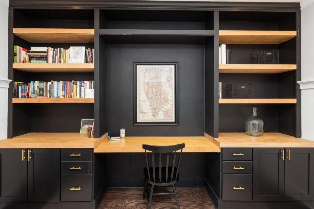 Desk with black and wood bookshelves (illustrative stock image)