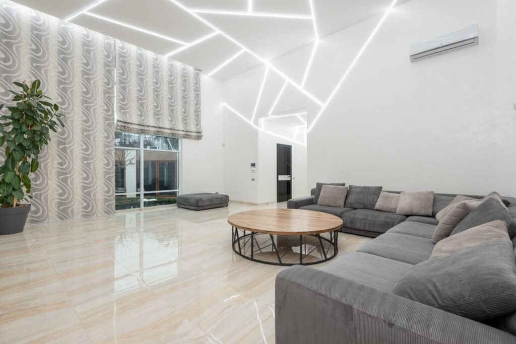 Living room with a white ceiling and LED light lines (illustrative stock image)