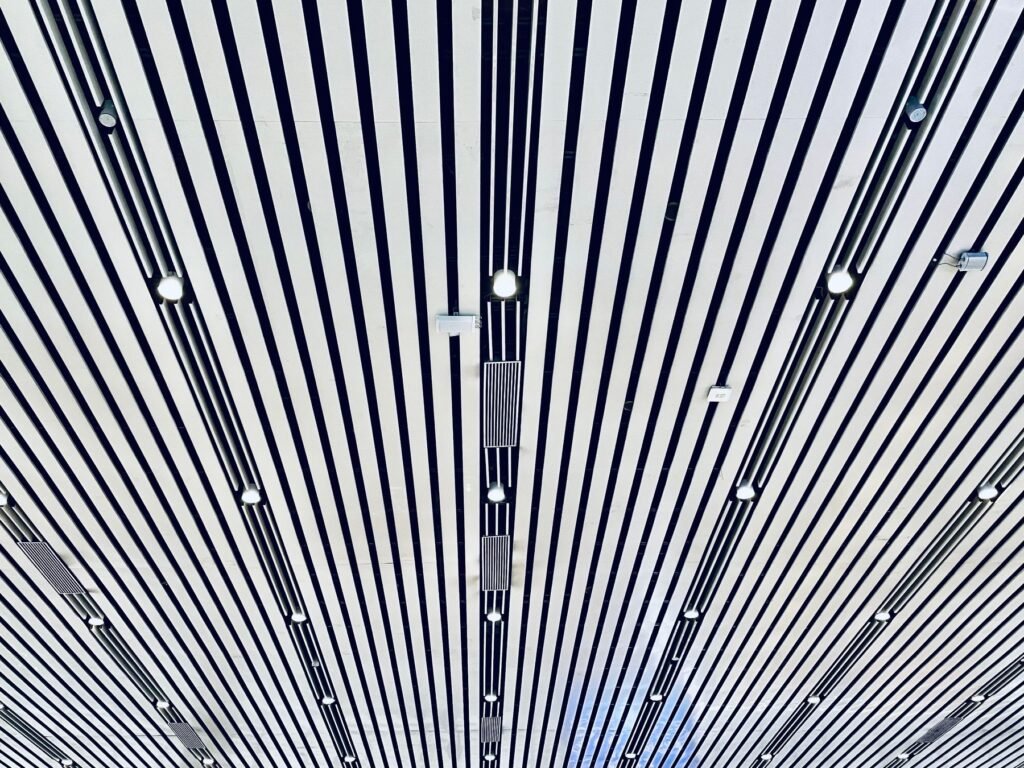 Linear panel ceiling with embedded lights (illustrative stock image)