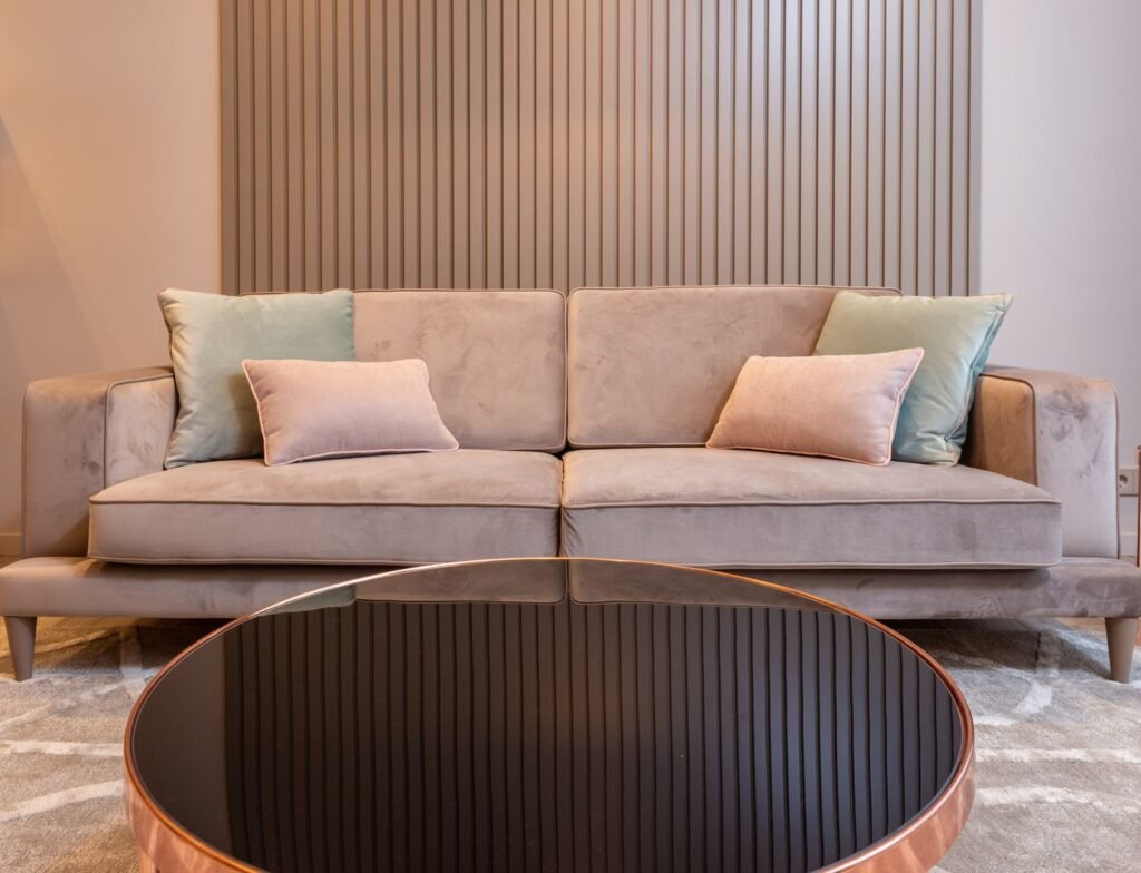 Sofa with round glass coffee table (illustrative stock image)