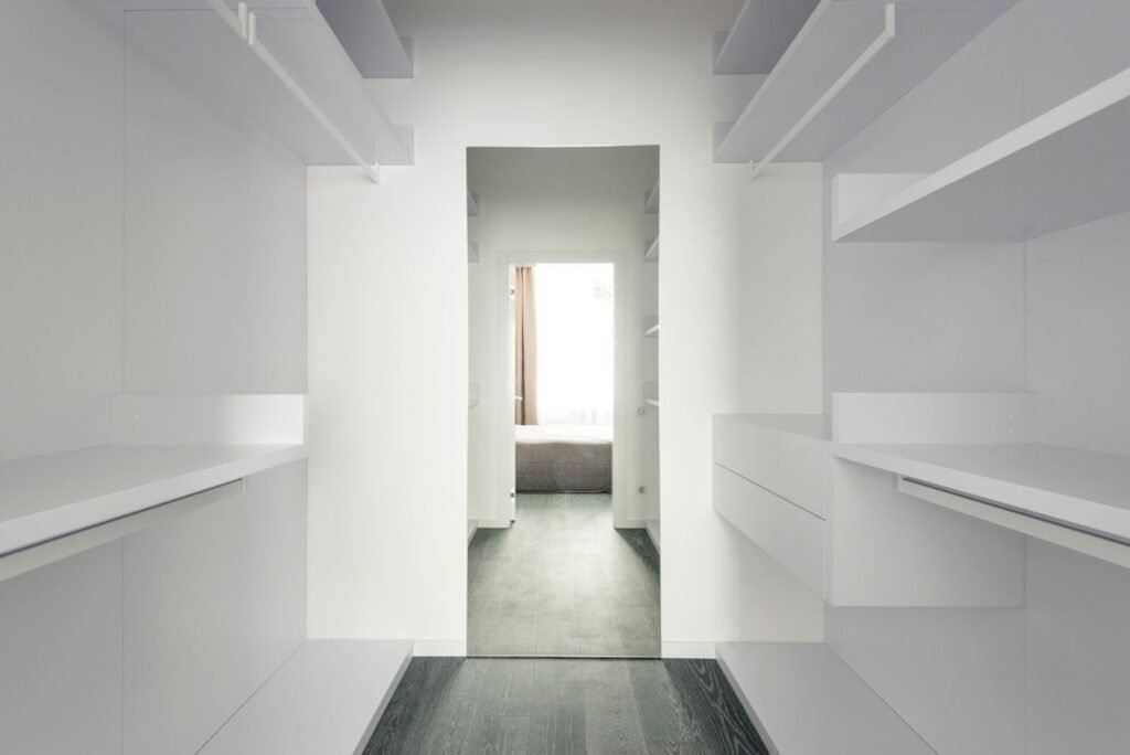 Walk-in closet with open shelving (illustrative stock image)
