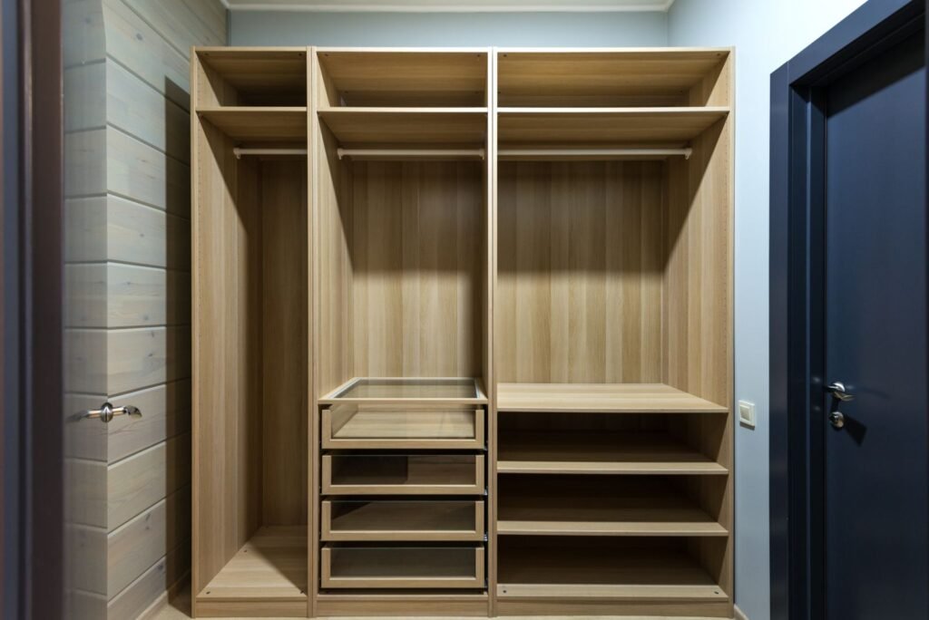 Wooden wardrobe interior with shelves and drawers (illustrative stock image)