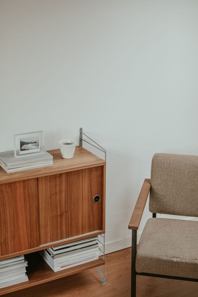 Wooden cabinet and armchair corner (illustrative stock image)