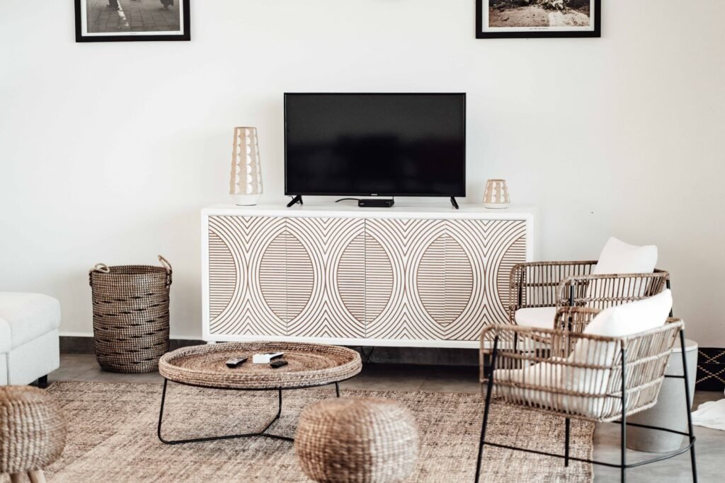 Patterned white sideboard with a TV in a living room (illustrative stock image)