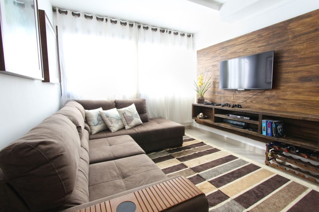 Living room with a wood-panelled TV wall and floating media unit (illustrative stock image)