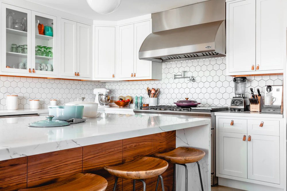 White kitchen with island and bar stools (illustrative image)