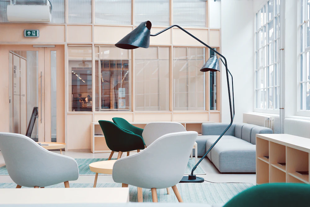 Interior with lounge chairs and a large floor lamp (illustrative image)
