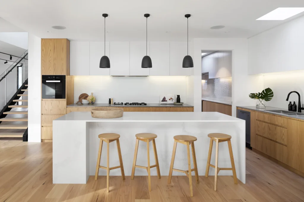 Modern kitchen with island and pendant lights (illustrative image)