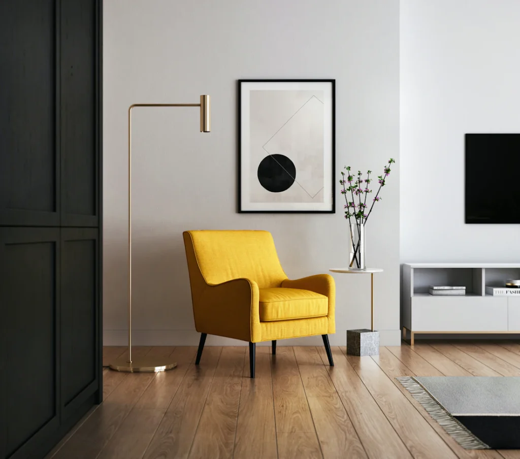 Living area with TV on a white unit and yellow accent chair (illustrative image)